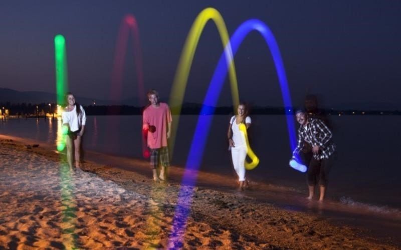 Group Playing Bocci Ball on Beach Cropped